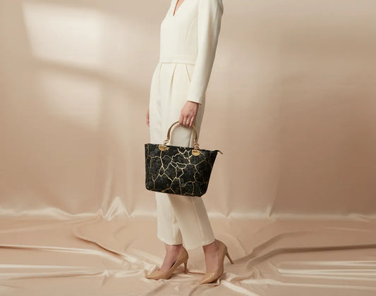 Stylish black velvet handbag with marble pattern Pakistan