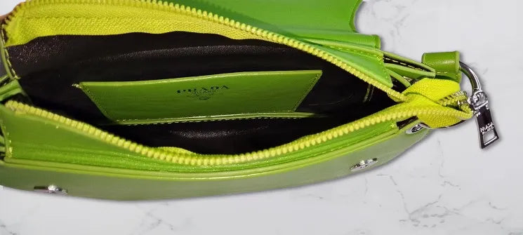 Green Prada inside open view on a white background