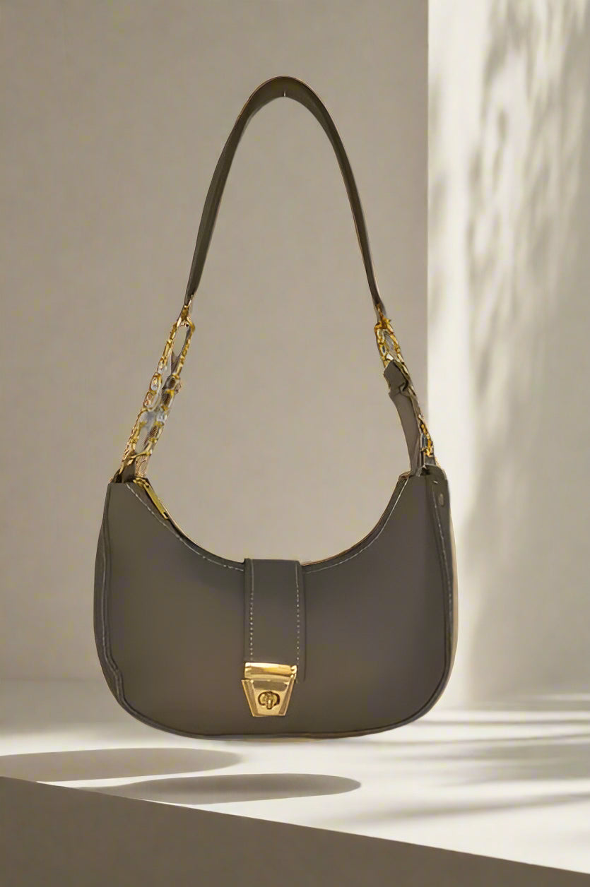 Grey shoulder moon-bag with gold accents