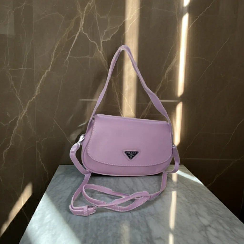 purple handbag on a marble surface with a marble wall background