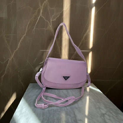 purple handbag on a marble surface with a marble wall background