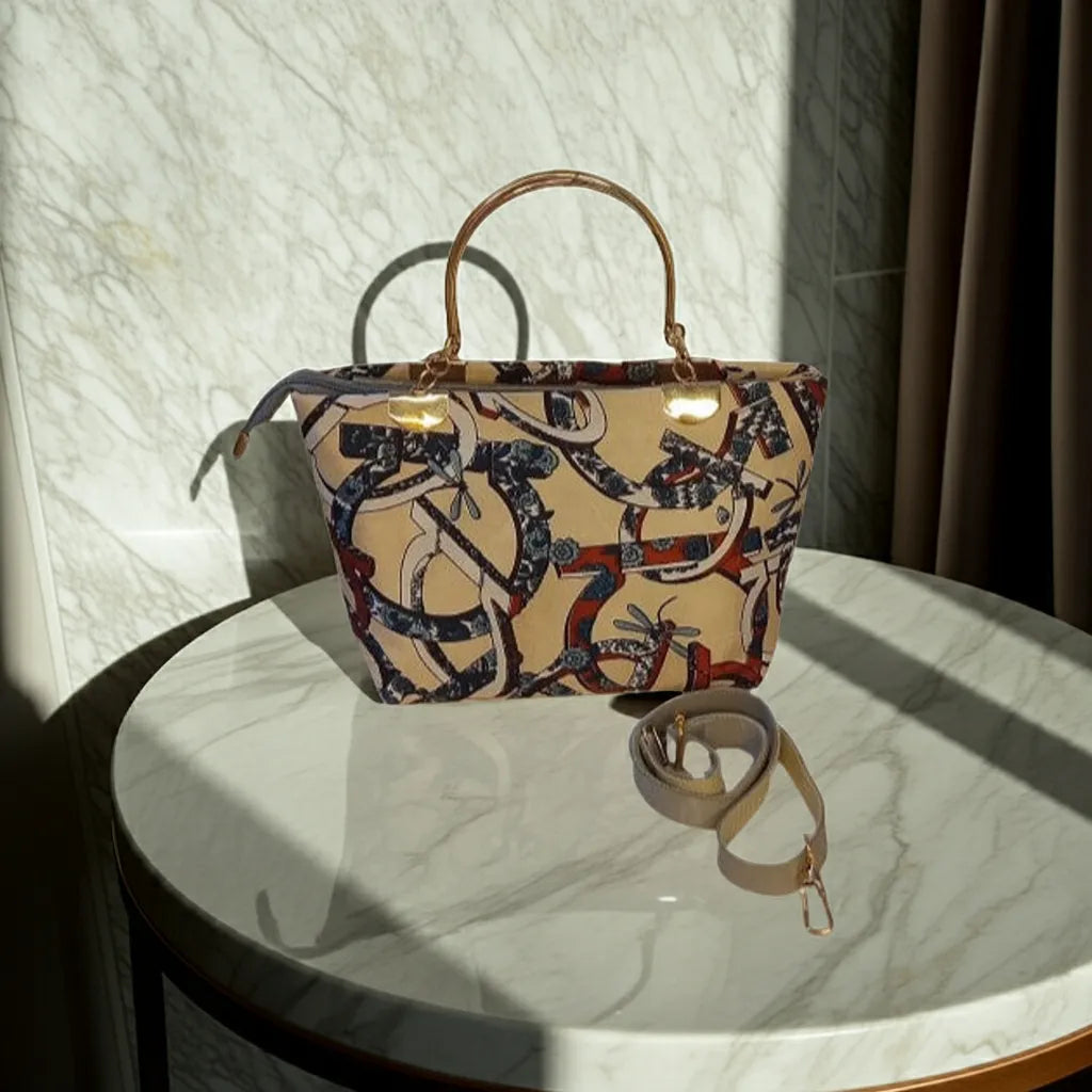 Patterned handbag on a marble surface with sunlight casting shadows