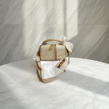 Elegant beige shoulder and crossbody handbag with bow
