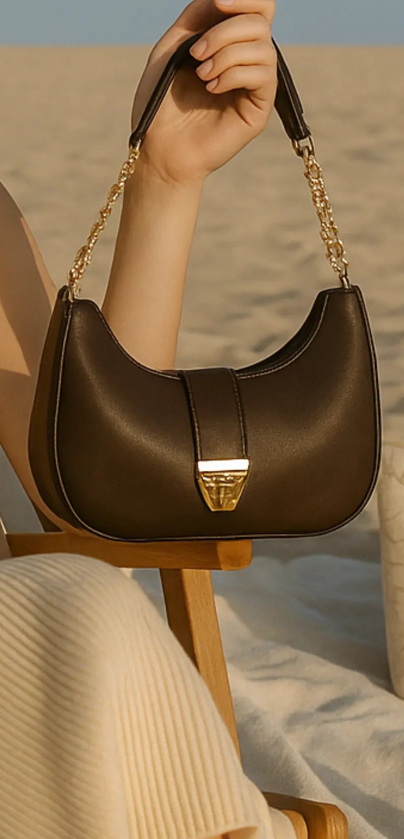 Woman sitting on a beach chair with multiple handbags around her