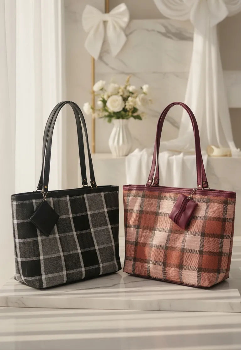 Two plaid handbags, one black and one pink, on a surface with decorative elements in the background.