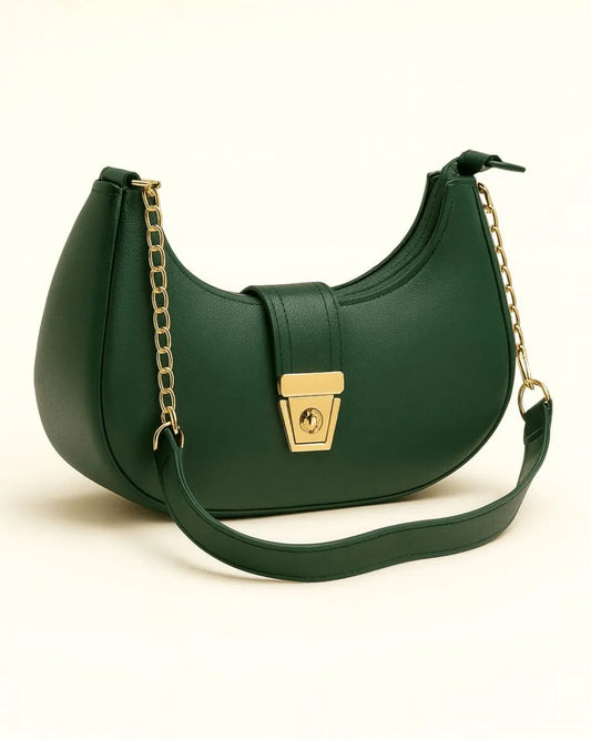 Green handbag with a gold chain strap on a white background