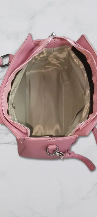 mauve purple handbag with open zipper inner view on a light gray background