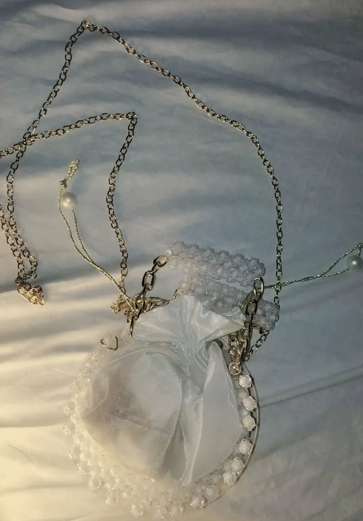 Necklace with a heart-shaped pendant on a white fabric background