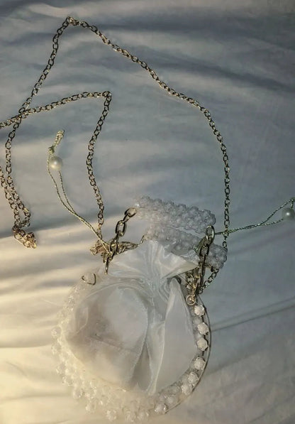 Necklace with a heart-shaped pendant on a white fabric background
