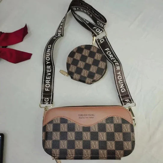 Checkered handbag with 'Forever Young' strap on a white background