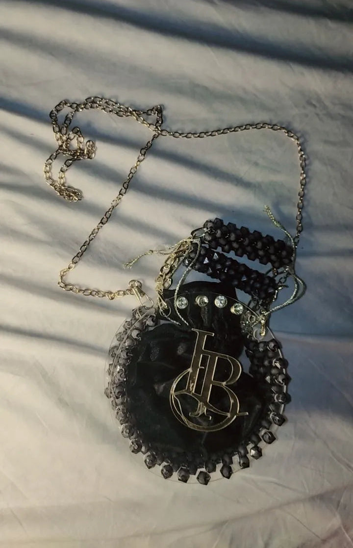 Necklace with a decorative pendant on a textured surface