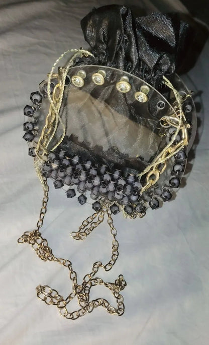 Decorative brooch with pearls and gemstones on a light background