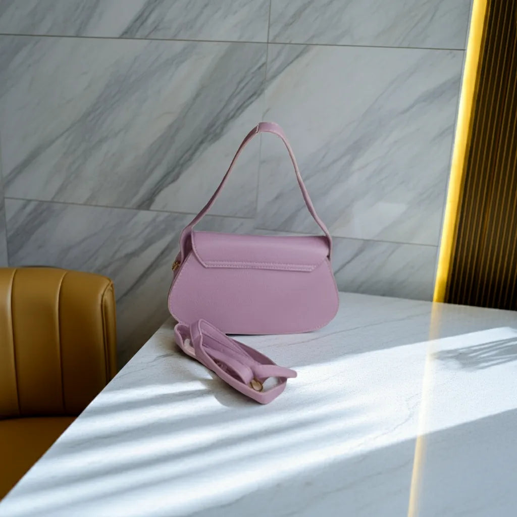 purple handbag on a marble table with a marble wall background