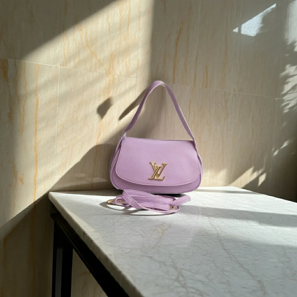 Purple handbag with gold logo on a marble surface