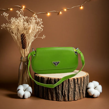 Green handbag on a wooden stump with decorative elements on a brown background